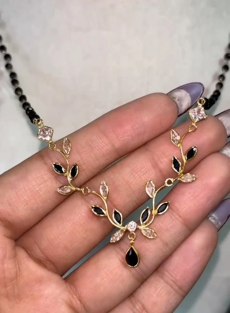 Black bead chain with flower petal pendant